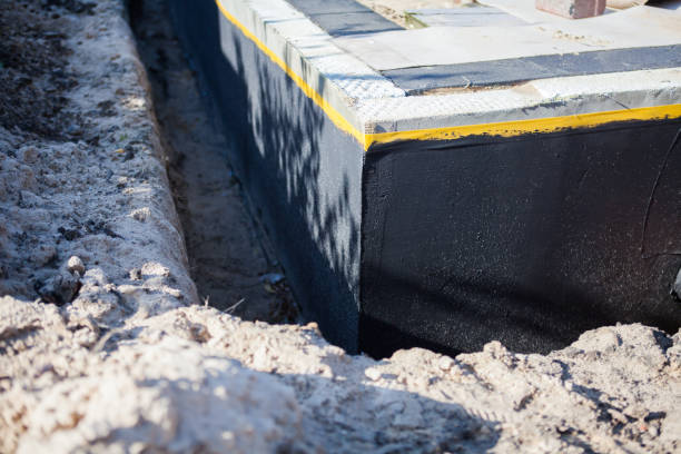 Professional Basement Waterproofing technician working in Caledonia, NY